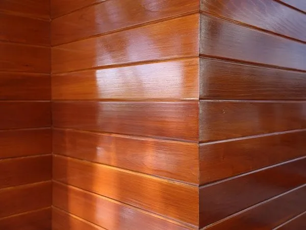 Closeup of wood exterior siding after adding protective coating