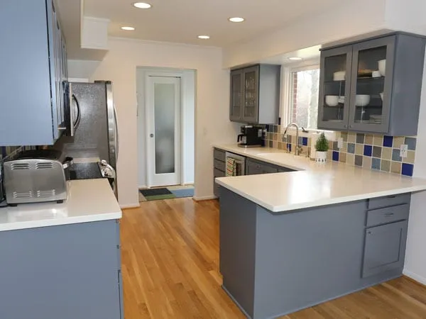 https://tribblepainting.com/wp-content/uploads/2020/01/Angled-view-of-kitchen-after-painting-the-cabinets.jpg