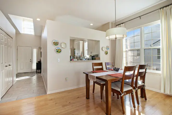 A dining area painted by Tribble Painting Company a white dining area