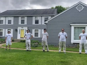 Tribble-painting-team-outside-a-finished-project-where-they-used-the-best-exterior-house-paint Tribble Painting Company workers pose in front of a painted home - how to paint shutters
